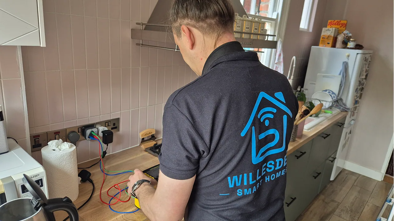 Testing a kitchen socket and worktop supply during fault finding.