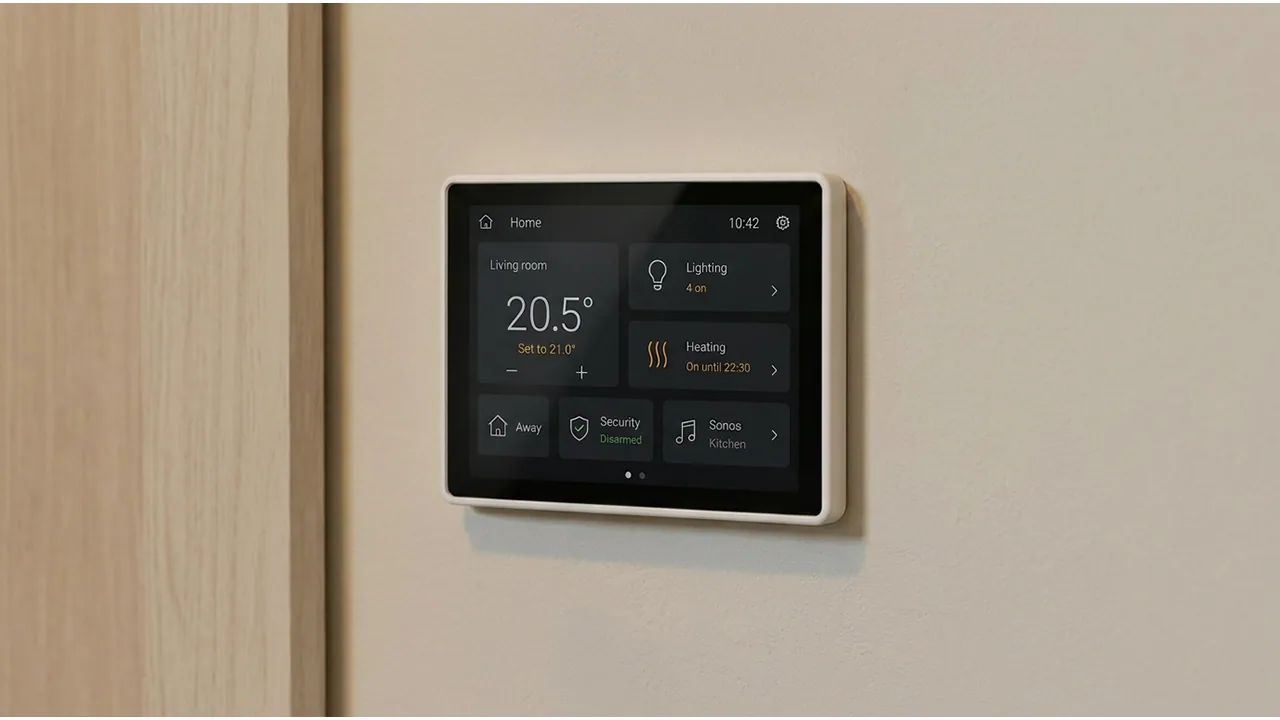Wall-mounted smart-home control showing heating, lighting and security options